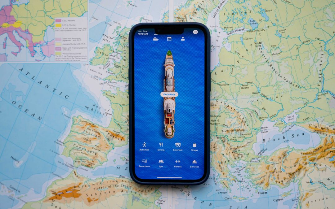 A mobile phone with a cruise app on screen in front of a map